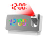A digital alarm clock displaying 12:00 AM and temperature, with a red light beam shining onto the display.