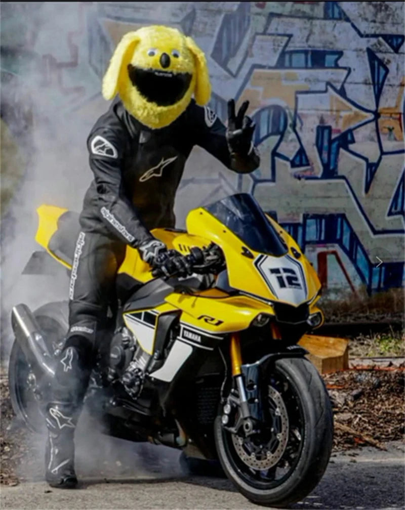 A yellow cartoon plush helmet cover is displayed on a motorcycle.