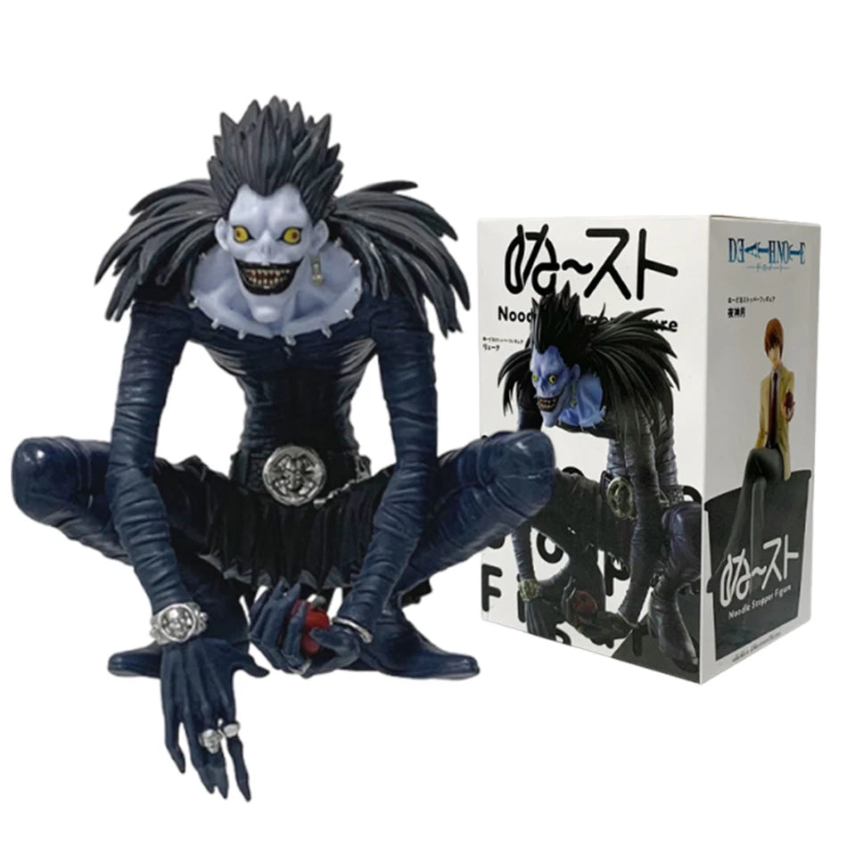 PVC figure of Death Note character Light with dark hair and intense expression.