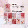 A pack of gradient wash retro decorative paper in shades of pink and gold, featuring various marbled textures.