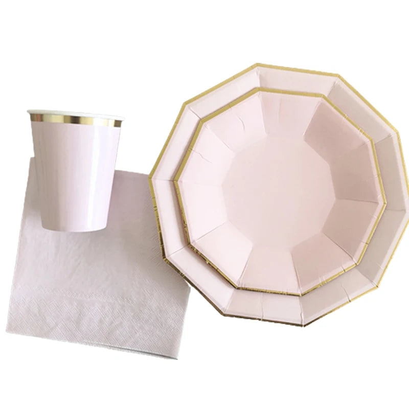 Gold and pink disposable party tableware set including cups, napkins, and straws.