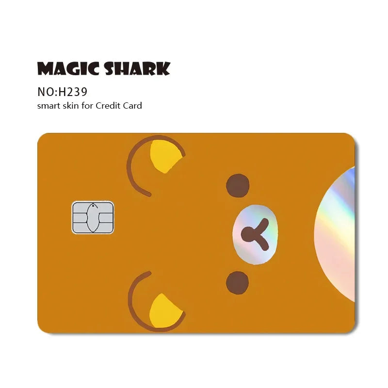 A close-up view of a gold credit card skin sticker with a holographic design and a chip.
