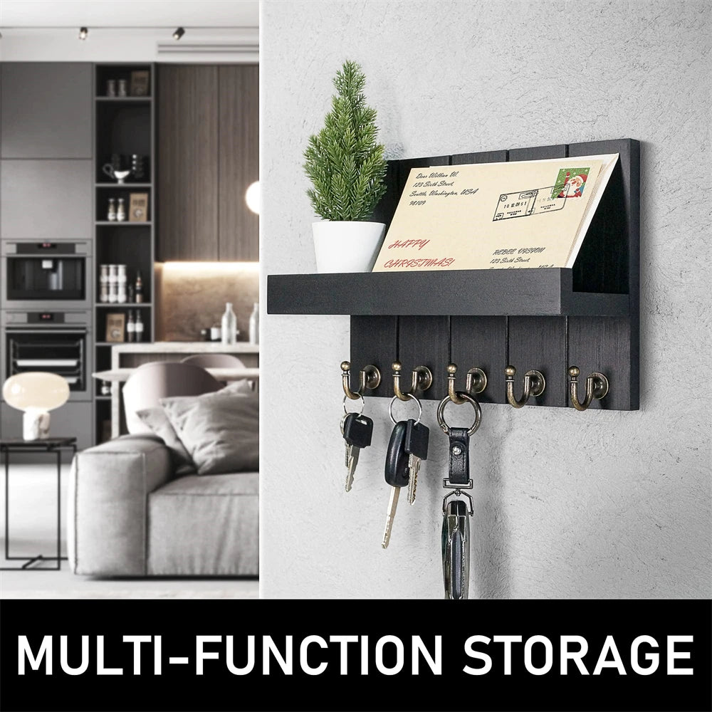 Rustic wooden wall-mounted organizer for mail and keys featuring five hooks mounted on a gray wall.