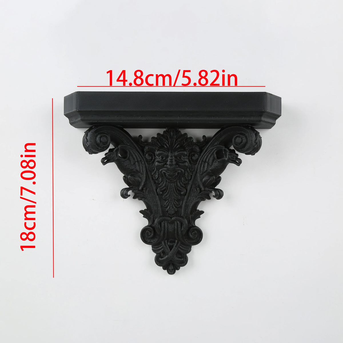 Black ornate gothic wall shelf featuring intricate carvings and decorative molding.