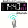 A digital wall clock displaying the time 14:40, temperature 16°C, and a remote control.