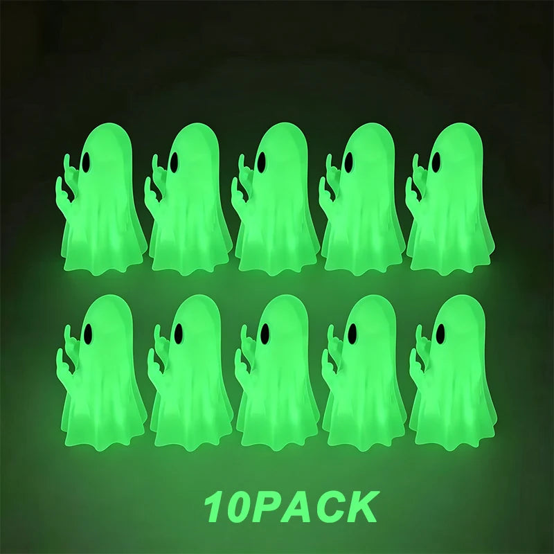 A pack of ten glowing green ghost figurines with playful hands against a dark background.