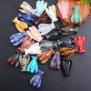 A collection of hand-carved crystal figurines shaped like angels in various pastel and earthy colors.