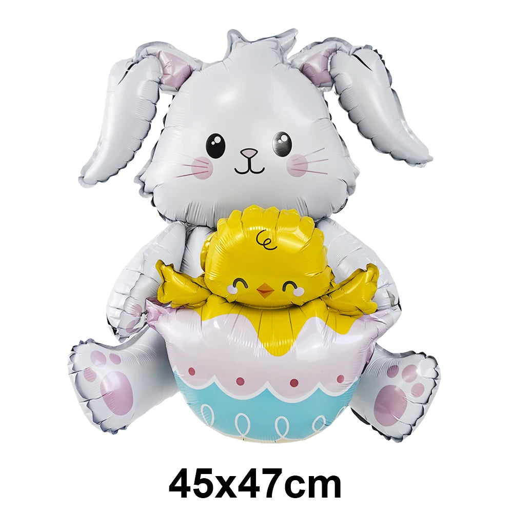 A white bunny foil balloon holding a yellow chick foil balloon.