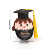 Handmade crochet potato doll with a graduation cap and inspirational slogan on the front