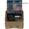 A wooden music box featuring an illustration of a detective character and internal mechanical components.