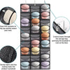 A hanging organizer with 27 clear PVC pockets for storing hats, featuring sturdy fabric and metal hooks.