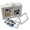 A white photo holder with two display pockets and a rotating mechanism, shown alongside separate clear plastic holders.