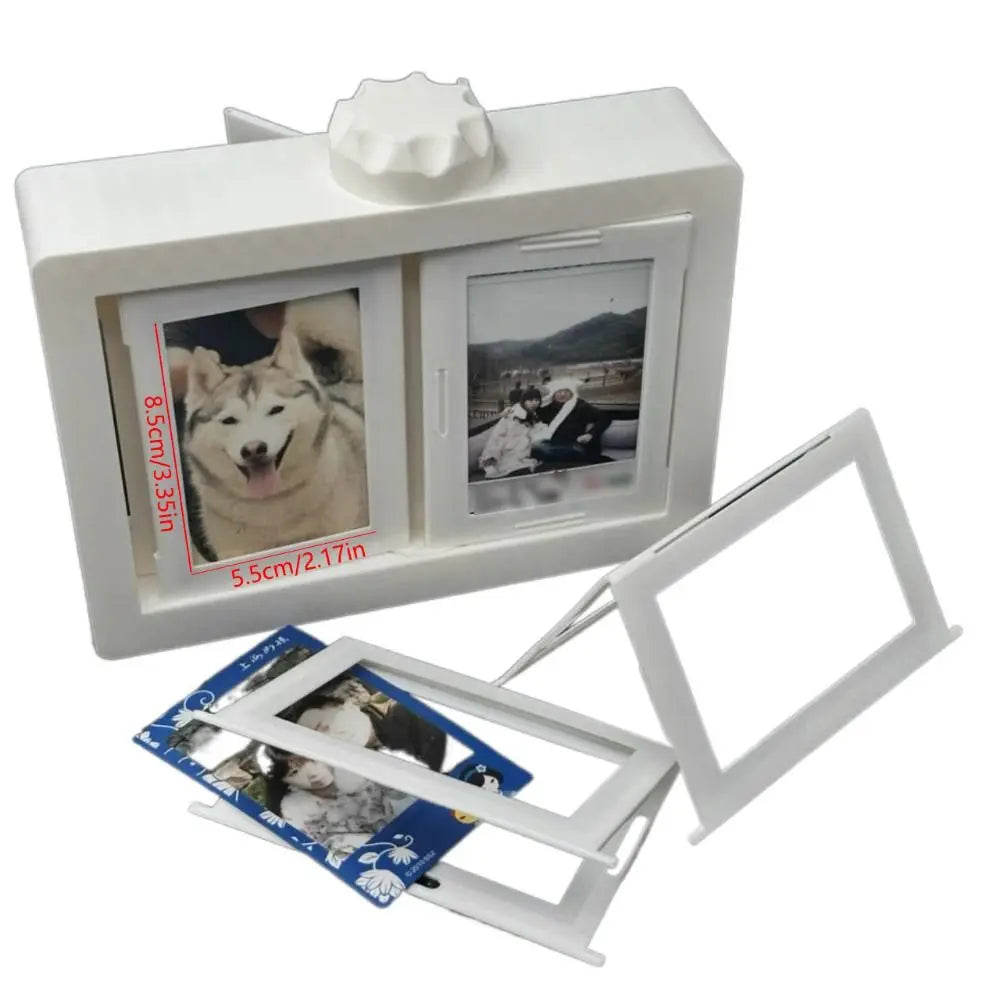 A white photo holder with two display pockets and a rotating mechanism, shown alongside separate clear plastic holders.