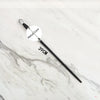 A black metal magic wand replica with a clear crystal tip and a 39cm length displayed on a white marble surface.