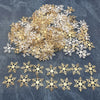 A pile of gold and silver frosted snowflake confetti for holiday decorations