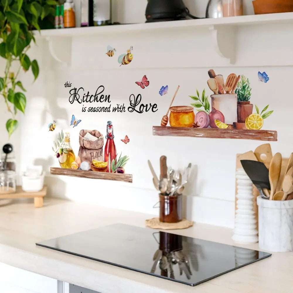 A white wall features a kitchen-themed decal with butterflies and the text seasoned with love.