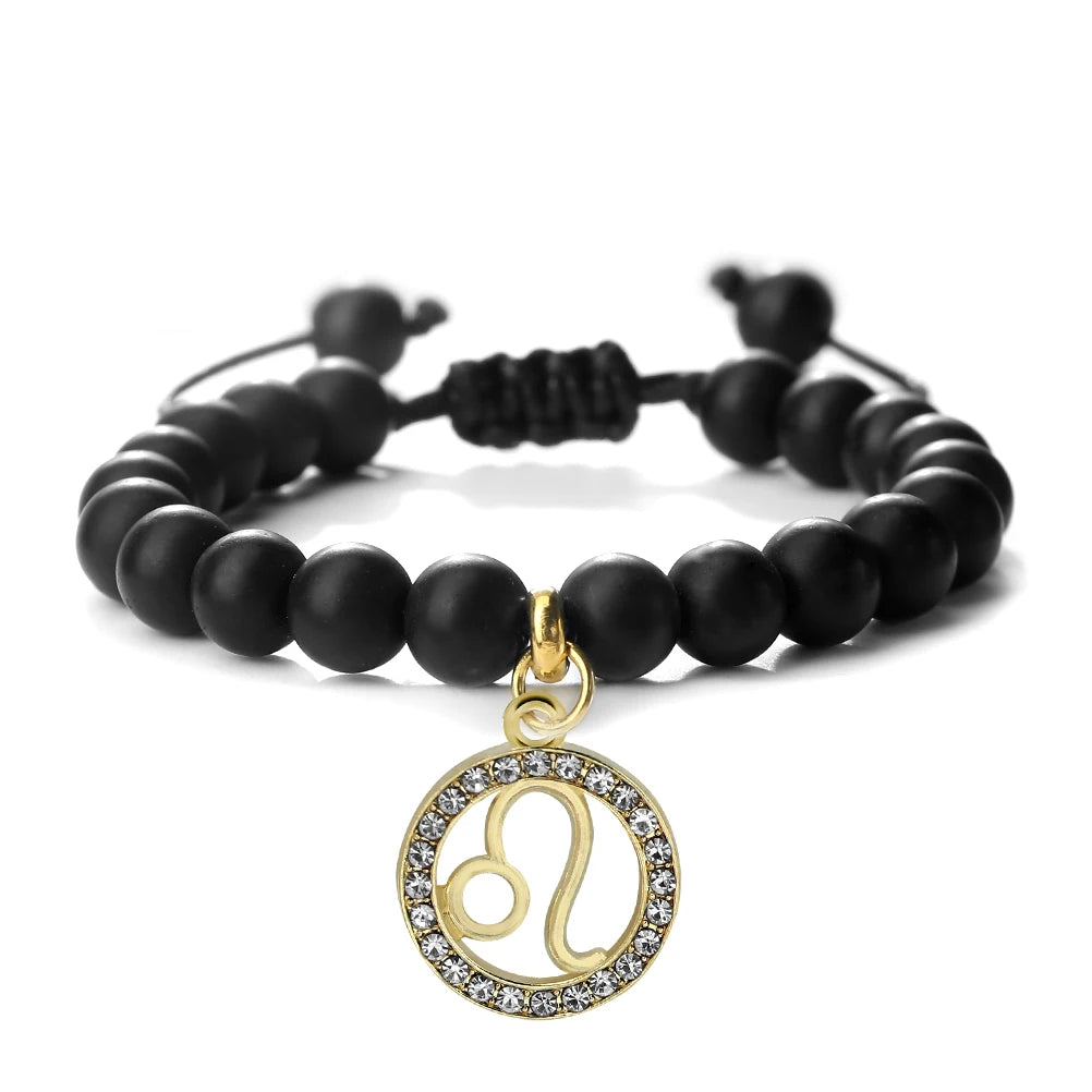 Handmade zodiac beaded bracelet with natural black stone featuring a gold charm of the Libra symbol