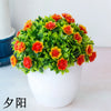 Un arrangement vibrant de fleurs de bonsaïs artificielles orange et rouge, dans un pot en céramique blanche.