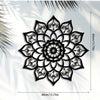Black metal wall decor featuring an intricate, symmetrical Art Deco style floral mandala design.