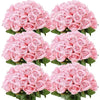 A bouquet of pink artificial silk roses in various shades and arrangements.