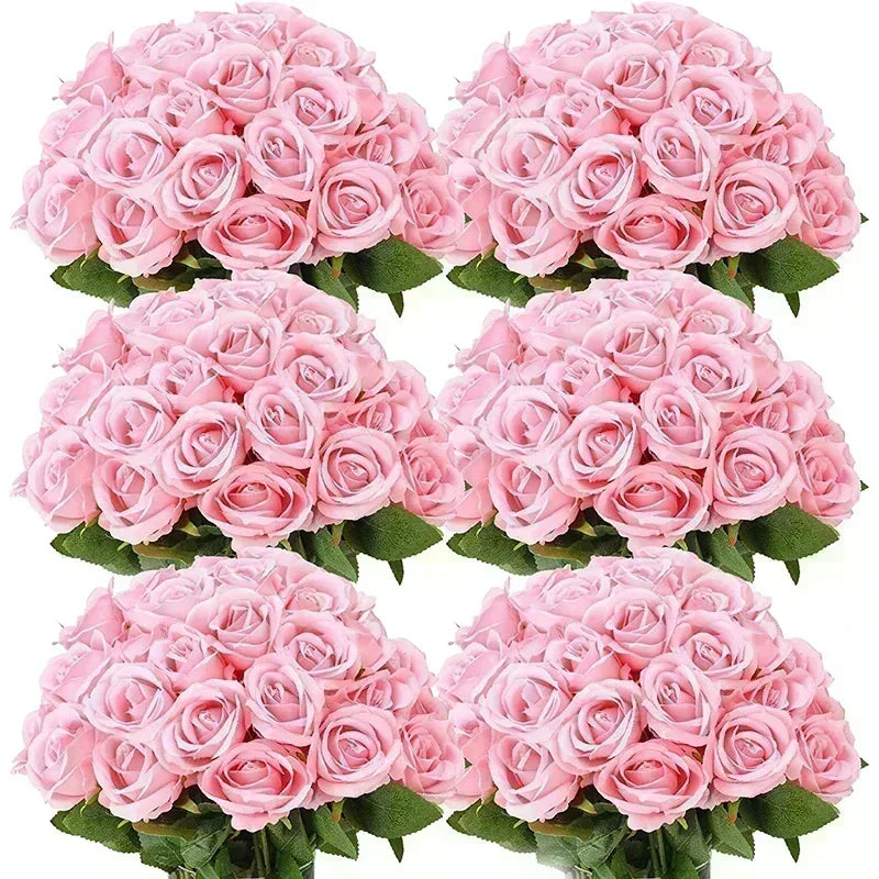 A bouquet of pink artificial silk roses in various shades and arrangements.