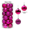 A box containing 24 pink and purple glitter Christmas tree ornament balls.