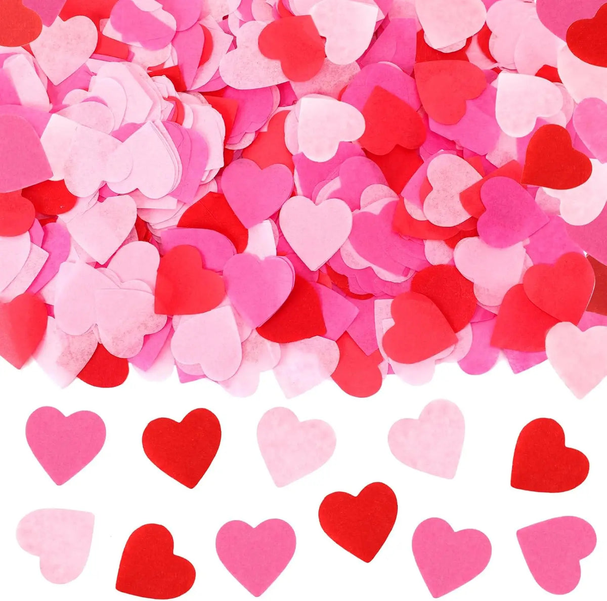 Pink and red heart-shaped sequins confetti scattered across a white background