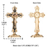 A gold-colored metal crucifix desk cross with a self-adhesive base shown from the front and back sides.