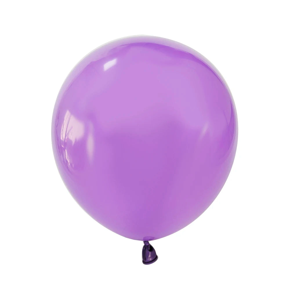 A single, smooth purple latex balloon floating against a white background.