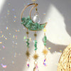 Handcrafted moon crystal suncatcher featuring a crescent moon and prism pendant with dangling crystals.