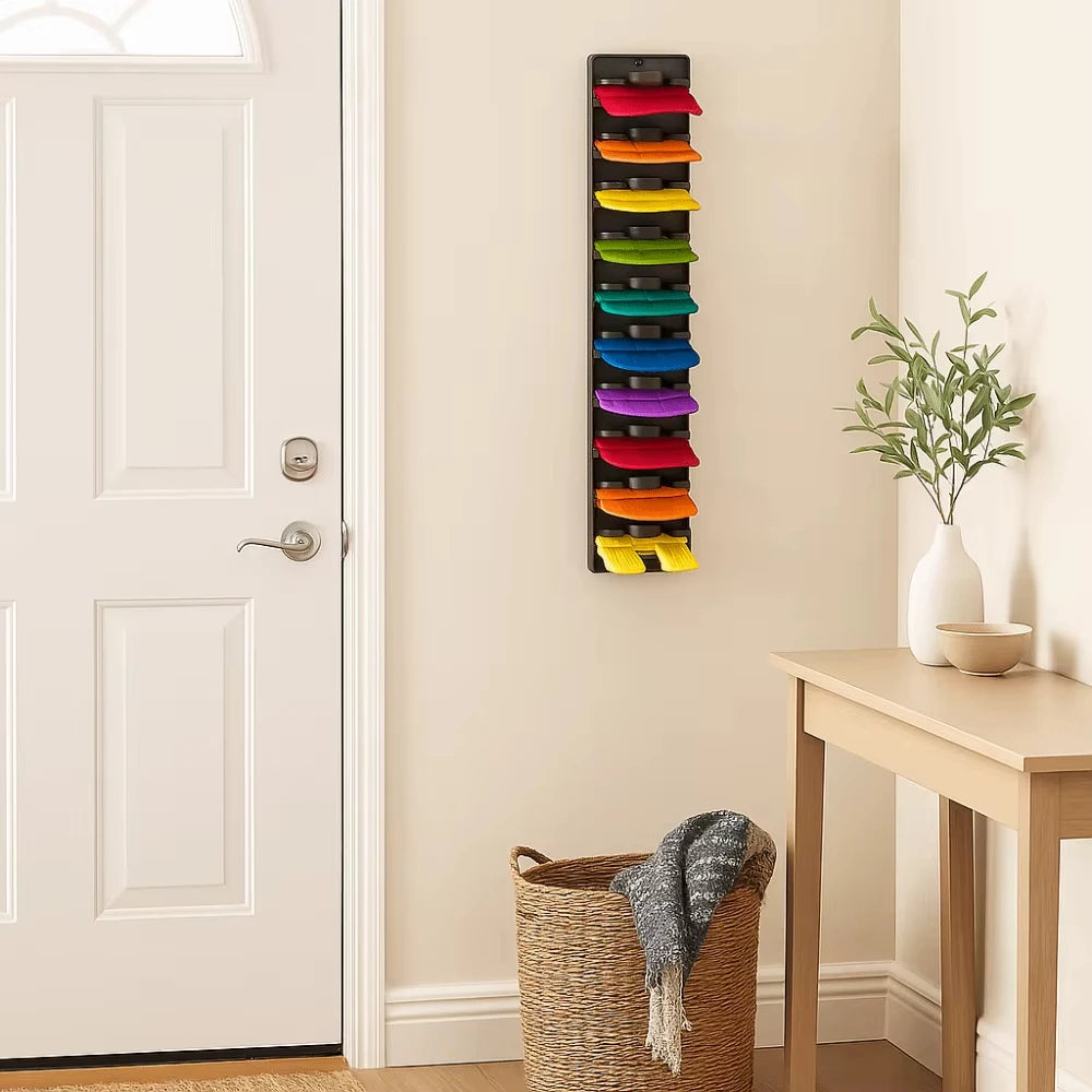 A vertical wall-mounted hat organizer rack displaying various colored hats.