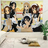 A tapestry featuring four anime characters from K-ON! in maid outfits decorating a room wall.