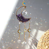 Handcrafted moon crystal suncatcher featuring a purple crescent pendant and gold prism charms.