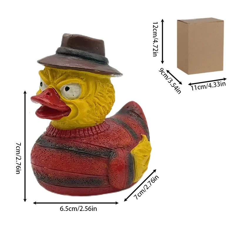 A resin figurine of a duck wearing a brown hat and a red striped sweater, used for spooky decor.