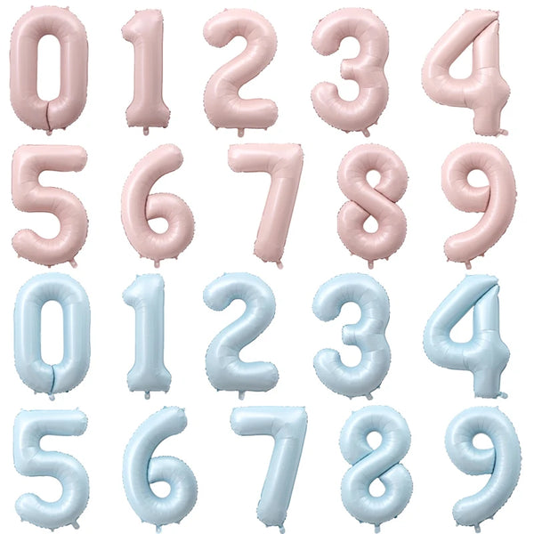 A collection of pink and blue foil number balloons from zero to nine.