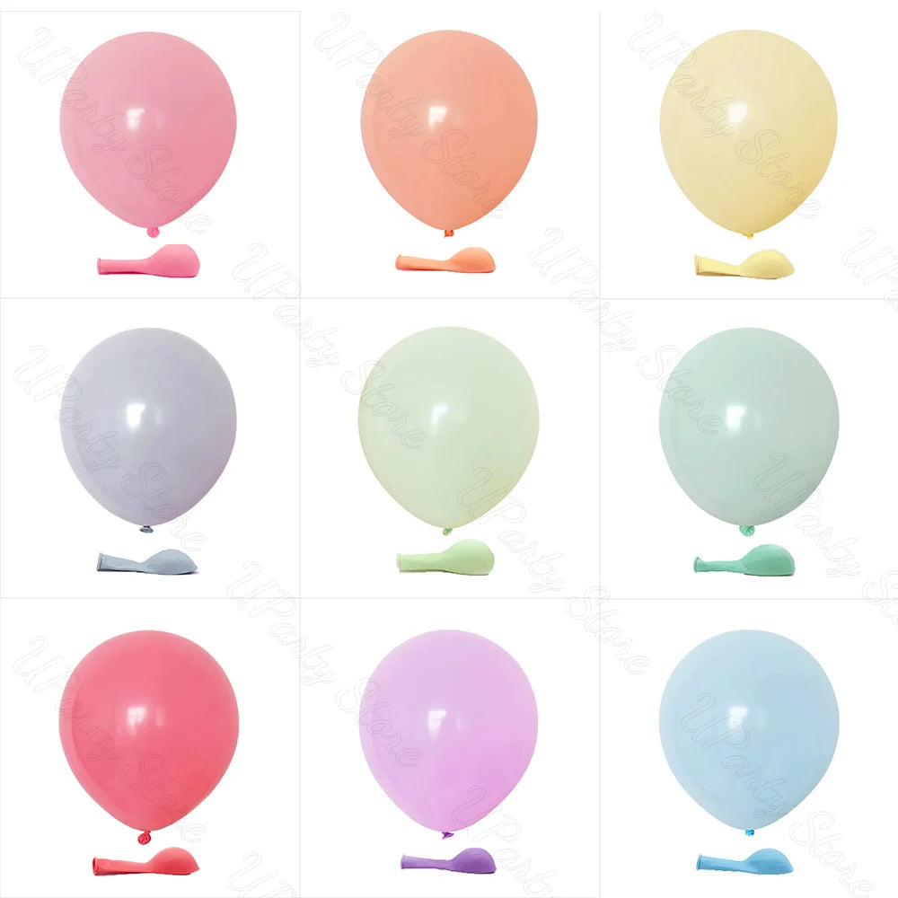 A collection of pastel macaron latex balloons in pink, peach, yellow, and light green shades.
