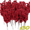A dense cluster of artificial red holly berry stems used for Christmas decoration.