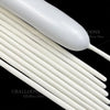 A close-up of white magic twisting balloons, showing the long, thin balloon tubes and a larger balloon head.