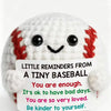 Handmade crochet baseball bat doll with a positivity card featuring messages like You are enough and You are so very loved.