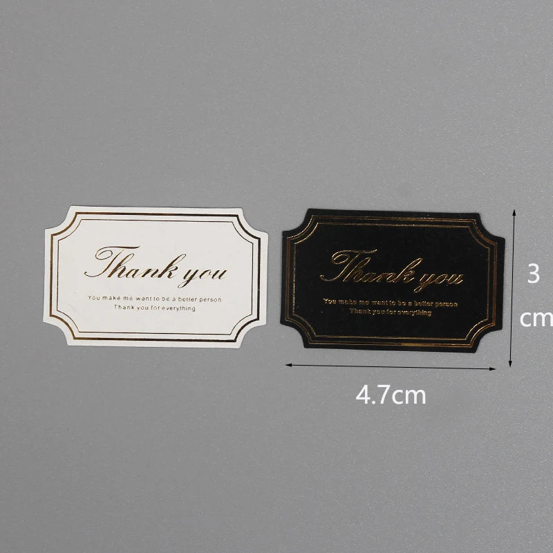 Two thank you seal stickers, one white and one black, are shown with dimensions.