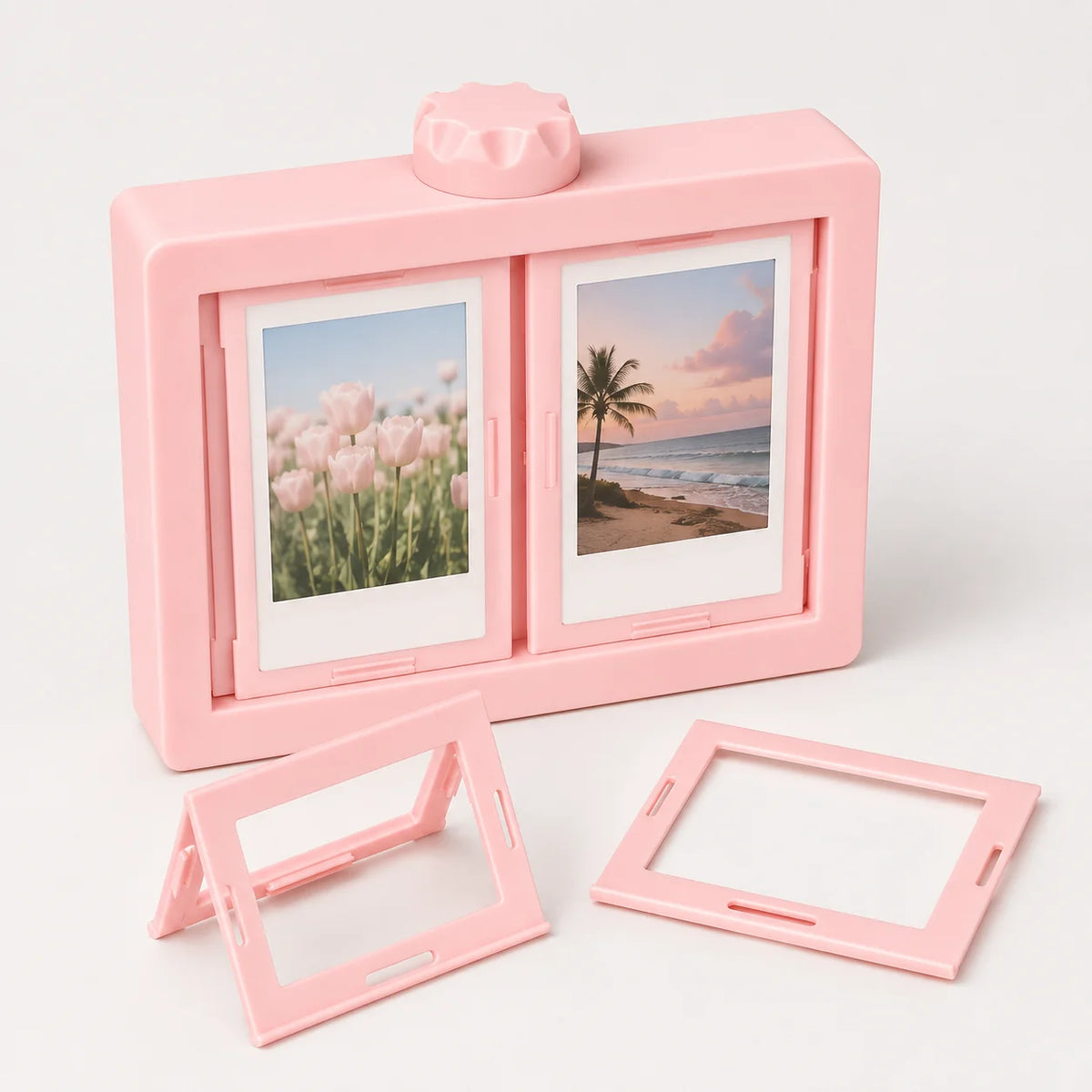 A pink 3D rotating photo frame with two display slots showing landscape photos.