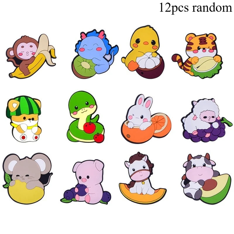 A collection of twelve random cute animal fridge magnets featuring characters like a yellow chick, a tiger, and a pink elepha