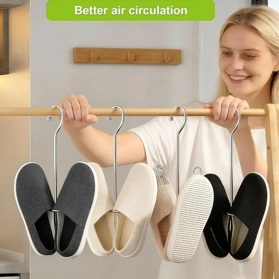 Stainless steel hanging shoe organizer with double hook displaying various pairs of shoes.