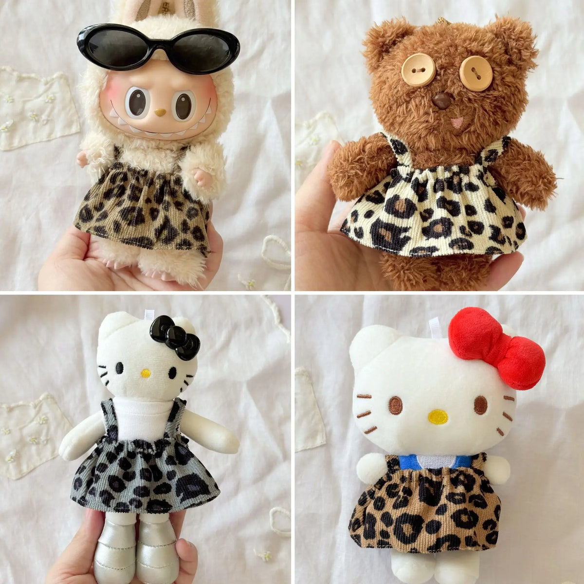 A collection of cute animal dolls featuring leopard print clothing and accessories.