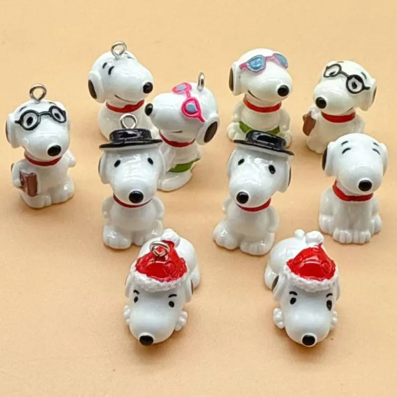 A collection of white ceramic dog pendants in various styles and colors for jewelry making.