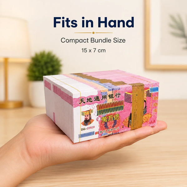 A hand holds a compact bundle of traditional joss paper hell bank notes for ancestral worship.