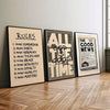 Three framed prints with scripture verses on a light gray wall above a wooden floor.