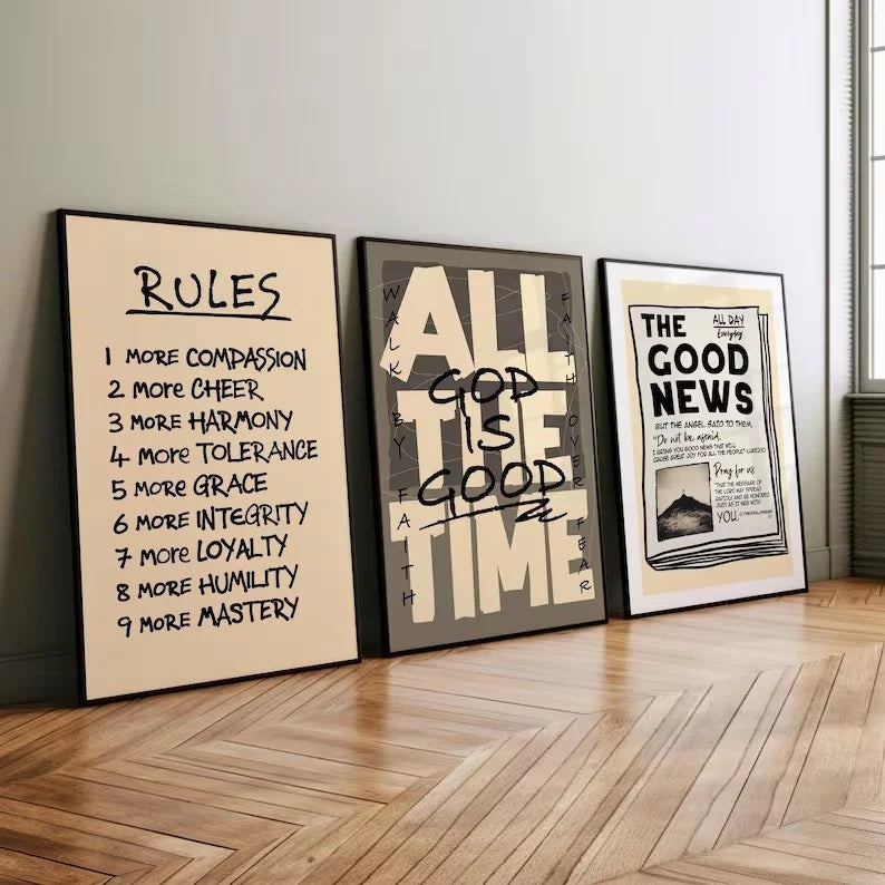Three framed prints with scripture verses on a light gray wall above a wooden floor.