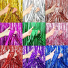 Various metallic foil fringe curtains in gold, silver, purple, green, and red are shown being held.