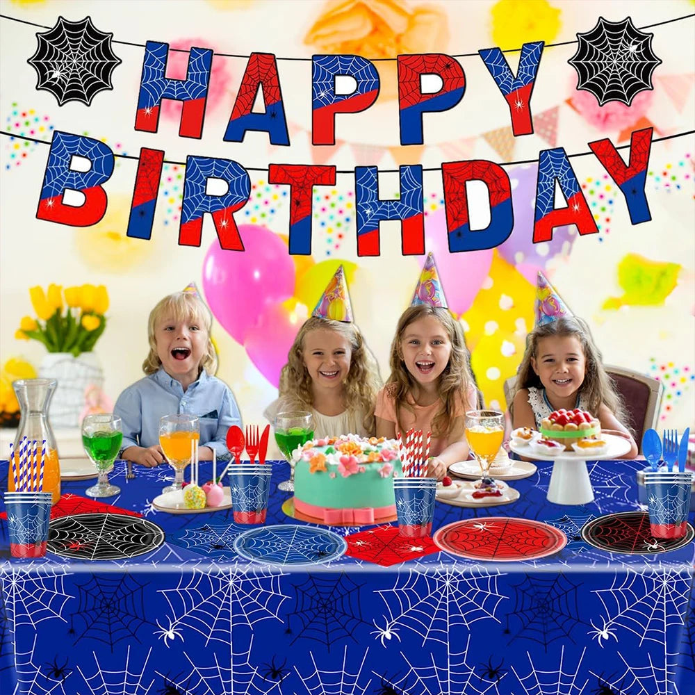 A colorful birthday party setup featuring a red and blue banner, balloons, and spider web decorations.